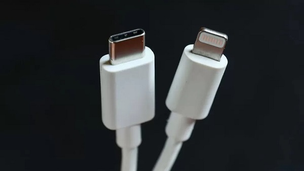 A USB Type-C charger (left) alongside Apple's proprietary Lightning cable