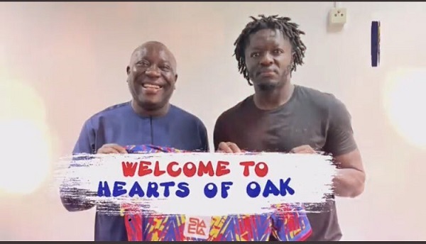 Sulley Muntari (right) with Vincent Sowah Odotel, bored member of Hearts