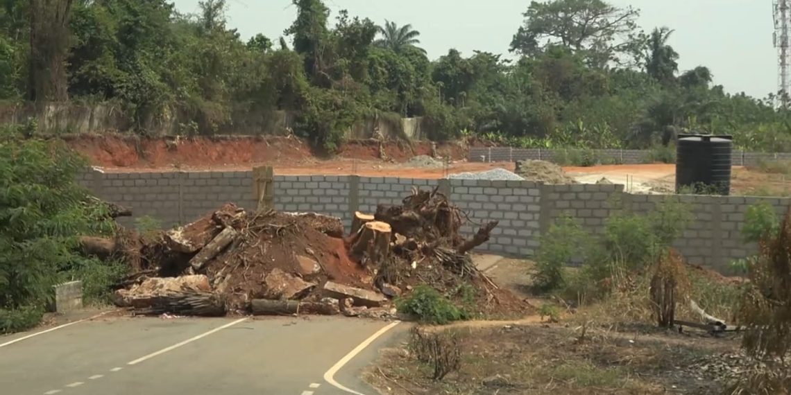 Ashanti Region: Private developer erects fence wall across asphalted road at Danyame
