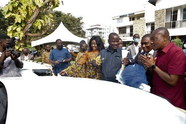 Mr Jinapor (3rd from right), Minister of Lands and Natural Resources, after cutting a tape to symbolically hand over the vehicles and other equipment to the Minerals Commission. Applauding are Mr Mireku Duker (2nd from right), Deputy Minister of Lands and Natural Resources, Mrs Barbara Oteng-Gyasi (4th from left), Board Chair of the commission, and Mr Martin Ayisi (right), Chief Executive Officer of the commission. Pictures: Emmanuel Quaye