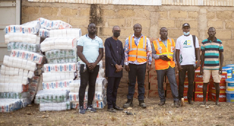 Dr. Isaac Dasmani (3rd from left), Chief Executive of Prestea Huni-Valley Municipal Assembly, and representatives of NADMO receive Newmont's donation to the Appiatse explosion victims