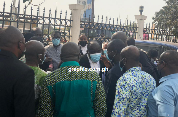 Mr Kwasi Keli Delataa, lawyer for UTAG, having a discussion with members of UTAG after the court hearing