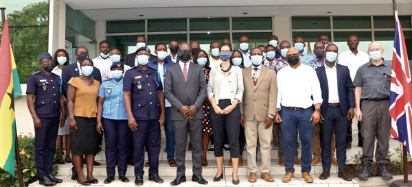 Ms Harriet Thompson (5th from right), British High Commissioner to Ghana, and Mr Kenneth Adu-Amanfoh, the acting Director-General of NACOC, with the participants