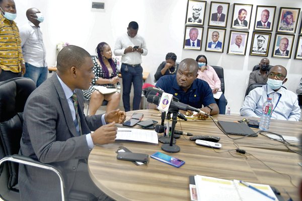 Mr George Mireku Duker (left), a Deputy Minister of Lands and Natural Resources, addressing the management of the Precious Minerals Marketing Company Limited. On his left is Nana Akwasi Awuah, Managing Director of the company. Picture: EMMANUEL QUAYE