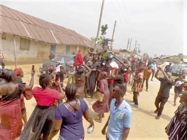 Nana Marfo Amparbeng being carried in palanquin through the principal streets of Anyinam Kotoku