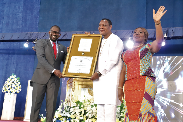 Rev. Dr Jason Renville (left) a UN Human Rights Ambassador, presenting the Lifetime Achievement Award to Rev. Sam Korankye Ankrah (2nd right), Apostle General of the Royal House Chapel International, at the ceremony in Accra. With them is Rev. Mrs Rita Korankye Ankrah (right), the Founder and President of the Royal Ladies Ministries International. Picture: Gabriel Ahiabor