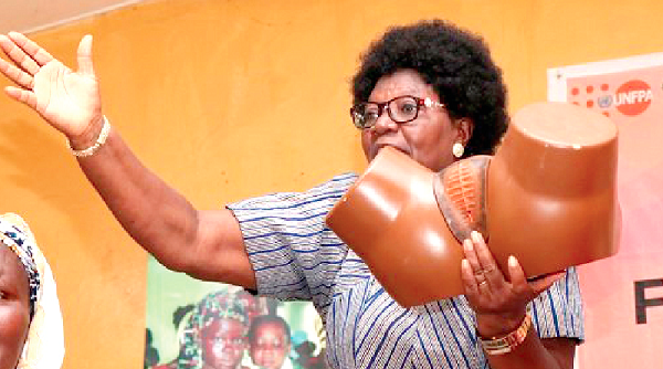 Mrs Eunice Maasodong, President of the Association of Ghanaian Women and Children’s Welfare, showing a dummy of how FGM is done