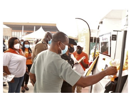 Mr Kwame Osei Prempeh (with mic), Group CEO and MD of GOIL, being assisted by other dignitaries to inaugurate the refurbished station