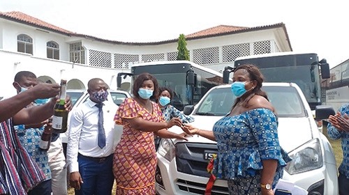 Mrs Justina Marigold Assan (second from left), Central Regional Minister, presenting keys to Madam Cecilia Adzo Wofesor, the immediate past chairperson of the Conference of Heads of Assisted Secondary Schools