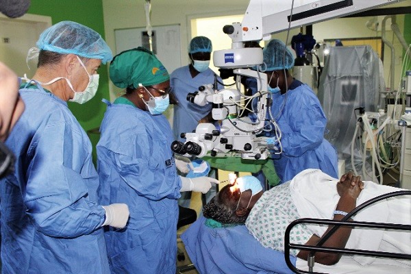 Dr Gladys Fordjour (2nd from left), Consultant of Ophthalmology at the Korle Bu Teaching Hospital, cleaning the eye during the surgery. With her is Dr Geoffrey Tabin (left), M.D of Fairweather Foundation Endowed Chair Professor of Ophthalmology and Global Medicine at Byers Eye Institute at Stanford Medicine. Picture: ESTHER ADJEI