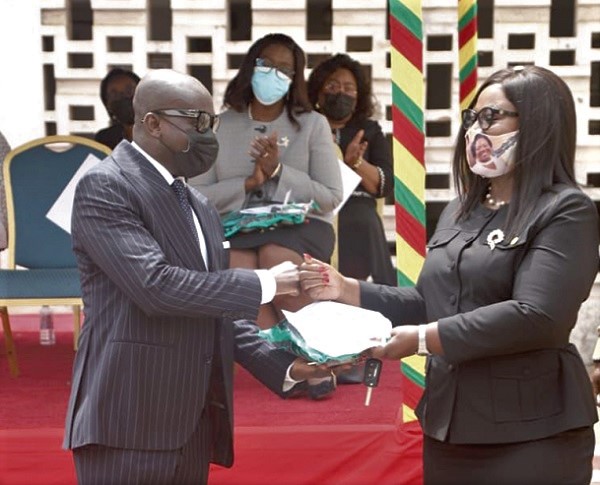 Mr Godfred Yeboah Dame (left), the Attorney-General, handing over the keys of EOCO vehicles to Commissioner of Police Mrs Maame Yaa Tiwaa Addo-Danquah, the Executive Director of EOCO