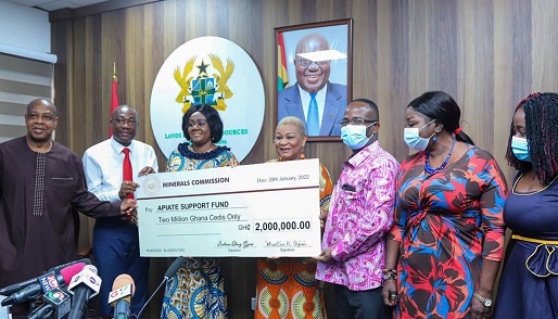 Mr. Martin Ayisi (2nd left), CEO of Minerals Commission, presenting a dummy cheque for GH¢2 million to the Appiatse Support Fund committee Chairperson, Rev Dr. Joyce Rosalind Aryee