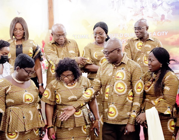 Mr Isaac Kofi Egyir (2nd from right), Director-General, Ghana Prisons Service, explaining a point to Prof. Mrs Irene S. Egyir (2nd from left), National President, Prison Officers’ Wives Association, and other members of the council after the event. Picture: EDNA SALVO-KOTEY