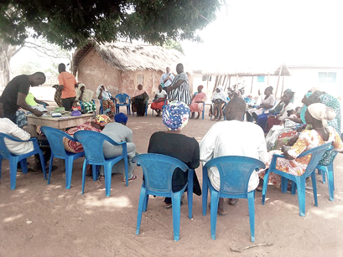 Mr Jeremiah Seidu (center), Director of Jaksally, interacting with some of the women