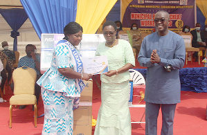 Ms. Monica Ankrah (middle), Greater Accra Regional Director of Education, presenting a certificate to Ms. Ophelia A. Sowah (left), the Overall Best Teacher. With them is Mr. Mordecai Quarshie (right), Municipal Chief Executive Officer of Ledzokuku Municipal. Picture: ESTHER ADJEI