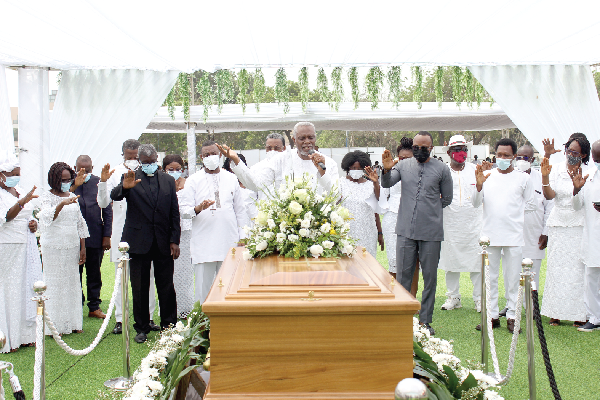 Dr Ishmael Tetteh (arrowed), founder of the Etherean Mission, praying for the remains of the late Torgbor Mensah. With him are some clergy men and women. Picture: ERNEST KODZI