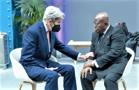 President Akufo-Addo (right) in a chat with Mr John Kerry, the United States Special Presidential Envoy for Climate, in France