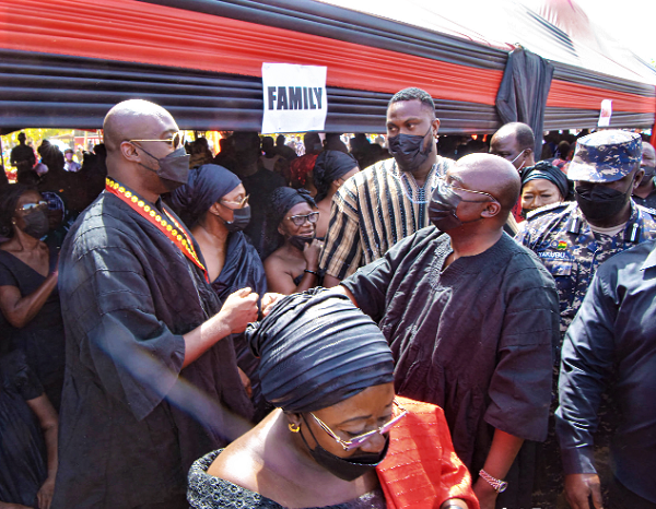 Dr Mahamudu Bawumia (right) interacting with  some members of the family of Mr Joseph Kofi Adda at last Saturday’s funeral