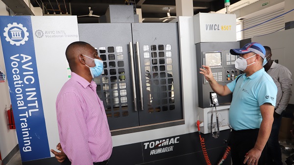 Mr Liu Xiaodong (right), Project Manager Avic International Holding Corporation explaining a point to Mr Isaiah Akure, Head of Mechanical Engineering. Picture SAMUEL TEI ADANO