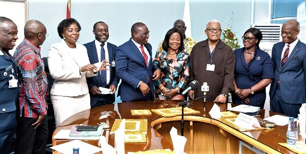 Mr Hassan Tampuli (5th from left), Deputy Minister of Transport, interacting with members of the reconstituted Board of Directors of the Ghana Civil Aviation Authority after their inauguration. Picture: EBOW HANSON.