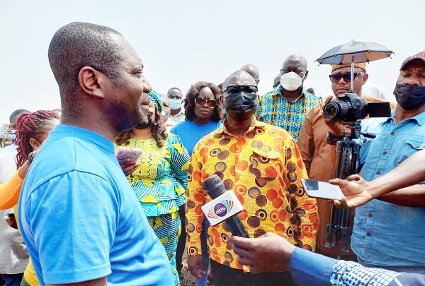 Mr Isaac Mensah (left), Head of Business Development at the State Housing Company, briefing Mr Francis Asenso-Boakye (middle), Minister of Works and Housing. On the right is one of the abandoned projects
