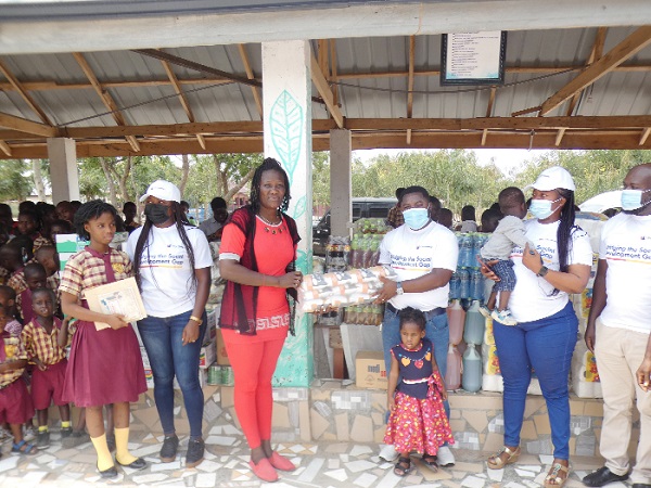 Mr John Kinney (3rd from right), CEO of John Kinney Foundation, making the donation to Mrs Naomi Esi Amoah, CEO of Royal Seed Home. Picture: ELVIS NII NOI DOWUONA