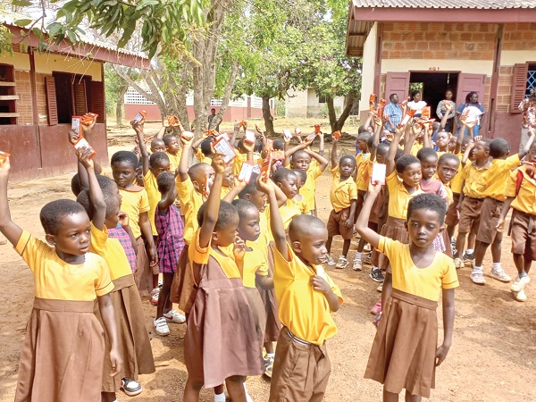 Schoolchildren displaying their chocolates