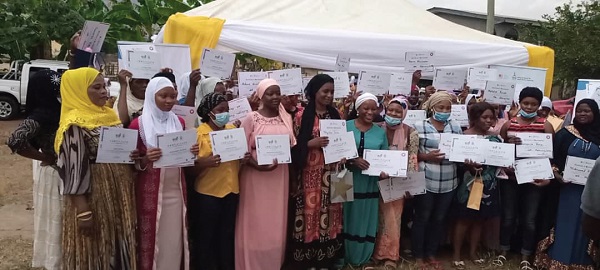 The make-up beneficiaries displaying their certificates after the training