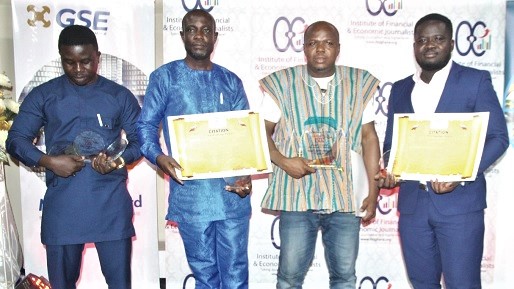 Mr Masahudu Ankillu Kunateh (2nd from right), the overall winner of the 7th IFEJ-Flamingo Awards with Maclean Kwofi (right), Daily Graphic, Edward Adjei Frimpong (left), Business and Financial Times, and Kingsley Asare, Ghanaian Times. Picture : ESTHER ADJEI