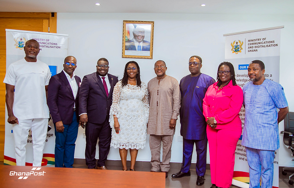 The Minister for Communications, Mrs Ursula Owusu-Ekuful, (5th right) in a group photo with the new board for the Ghana Post Company Limited after their inauguration.  