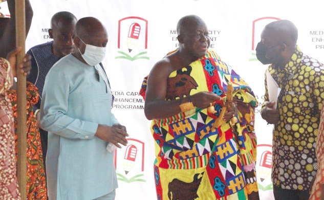 The Asantehene, Otumfuo Osei Tutu II (2nd from right), interacting with Mr Kojo Oppong Nkrumah (right), the Minister of Information. With them is Mr Simon Osei-Mensah, the Ashanti Regional Minister. Pictures: EMMANUEL BAAH