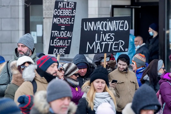 People take part in a demonstration against the Quebec government’s measures to curb the spread of COVID-19 in Montreal, Saturday, Jan. 8, 2022. THE CANADIAN PRESS/Graham Hughes
