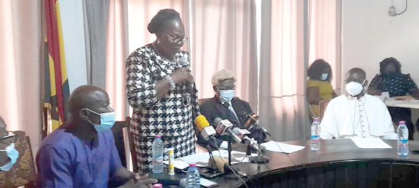 Ms Justina Owusu-Banahene (standing), Bono Regional Minister, addressing members of the Regional Coordinating Council