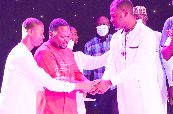 Mr Francis-Xavier Sosu (left), NDC Member for Parliament for Madina, and Prophet Sampson Amoateng (middle), Founder, House of Miracles Ministries, presenting the Sosu Best Teacher Award to Mr Clement Oscar Gaisie (right). Maxwell Ocloo