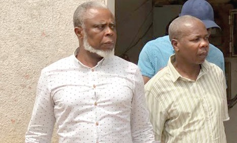  •  Dr Frederick Mac-Palm (left) and other suspects leaving the court