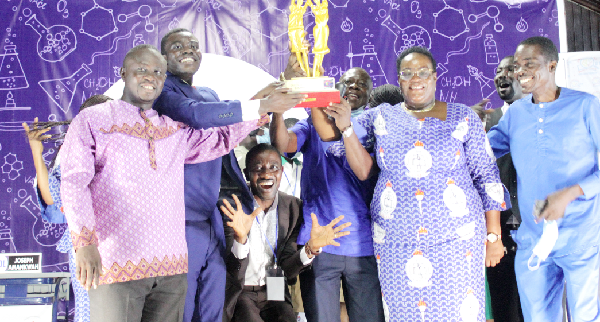 Mrs Arabah Bentum, General Manager of Catholic schools in Ghana, presents trophy to winners — Good Shepherd Junior High School. PICTURES: ERNEST KODZI  