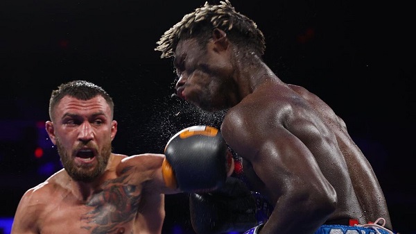 Flashback: Vasyl Lomanchenk connects a powerful left to the jaw of opponent Richard Commey in their bout last year