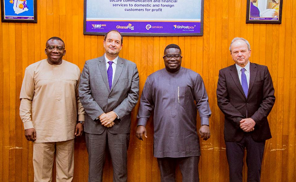 The Managing Director of Ghana Post, Mr Bice Osei Kuffuor (2nd right) with the two foreign consultants. At the extreme left is his Deputy, Mr Kwaku Tabi Amponsah.