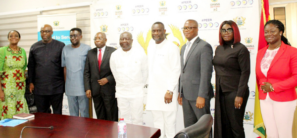  Mr Ken Ofori-Atta (middle), Finance Minister, Mr Kofi S. Yamoah, Chairman of the Board of Trustees of the Venture Capital Trust Fund, and other members of the board after the inauguration in Accra