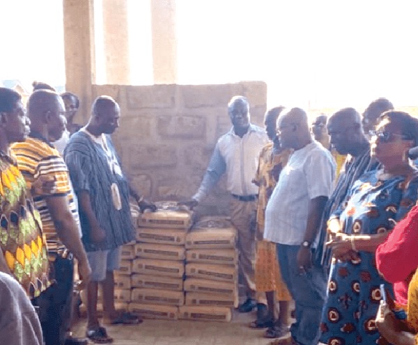 Mr Jerry Hanson (right), First Vice-Chairman for the Kwesimintsim Constituency, explaining the rationale for the donation