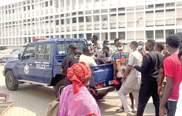 Some of the accused persons being whisked away in a police vehicle after proceedings