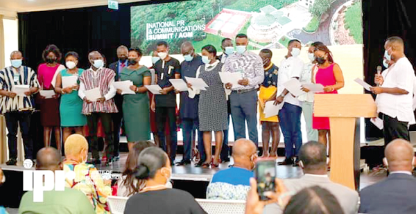 	Mr Mawuko Afadzinu (right), President of IPR-Ghana, swearing in newly accredited members of the institute