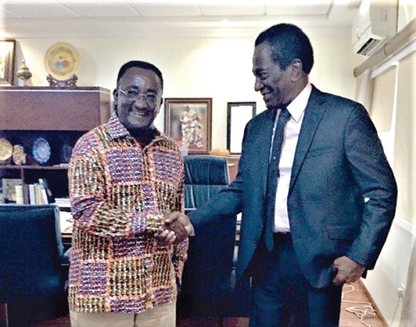 FLASHBACK: Dr Owusu Afriyie Akoto (left), Food and Agric Minister, being congratulated by Dr John Alleyne, Special Advisor to the Prime Minister of Trinidad and Tobago