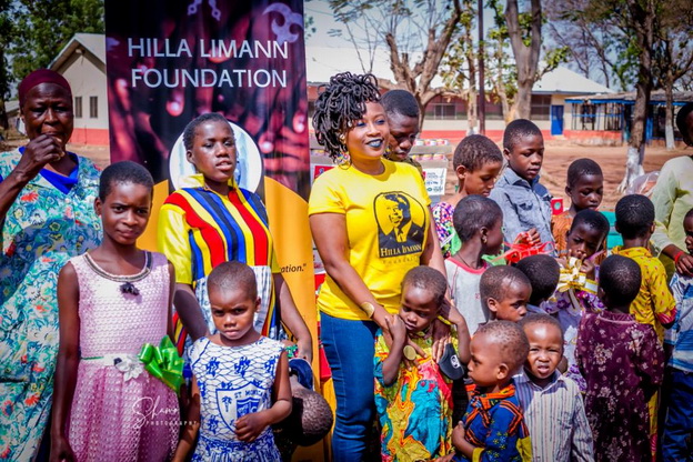 Dr. Zilla Limann with a section of the children of the home