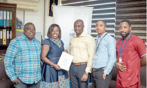Ms Diana Hamilton (2nd from left), Gospel Artiste and VGMA Artiste of the Year displaying the document. With her are Mr David Obeng Ennin (left), Executive Producer and Manager of Diana Hamilton; Mr Gerald Bonsu (middle), Commercial Director, Kasapreko Company Limited; Mr Jude Matti (2nd from right), Marketing Manager, Kasapreko Company Limited, and Mr Van-Edson Tsatsu Hadjor, Sales and Activation Manager, Kasapreko Company Limited.