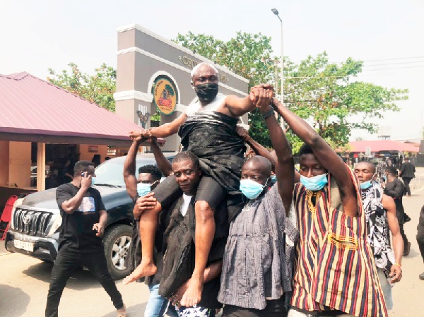 Barima Oppong Kodiee, the Manwerehene of Akyem Abuakwa, being paraded through the principal streets of Kyebi