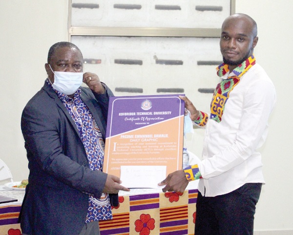 Professor David Kofi Essumang (left), Vice-Chancellor of KTU, presenting the award citation to Pacome Emmanuel Damalie, a Daily Graphic reporter 
