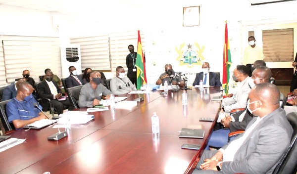 Mr Charles Adu Boahen (head of table, left), Minister of State, Ministry of Finance, addressing the press conference in Accra