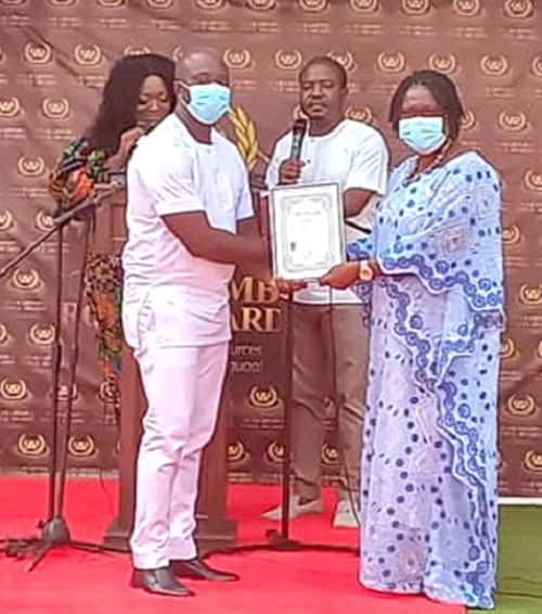 Mr Frederick Nyankah (left), Public Relations Officer of Cape Coast Teaching Hospital, receiving a citation on behalf of the health facility