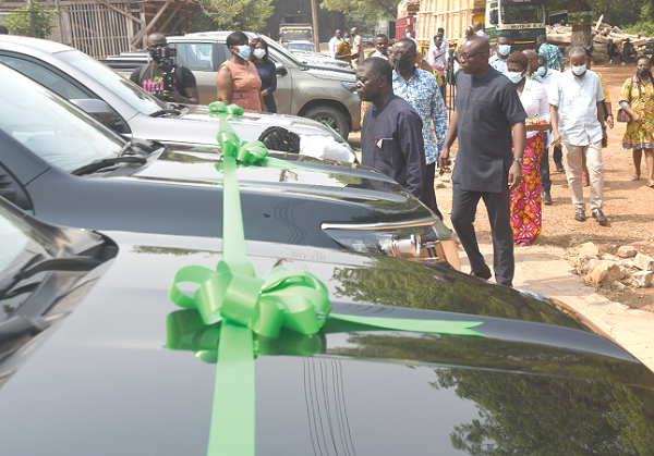 Mr Benito Owusu-Bio (arrowed), Deputy Minister of Lands and Natural Resources, and Mr Sulemana Nyadia, Deputy Chief Executive Officer of the Forestry Commission, inspecting the vehicles.